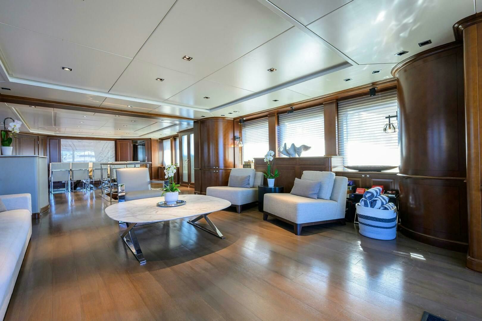 a living room with a table and chairs aboard ARTHUR’S WAY Yacht for Sale