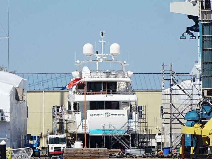 a large white ship in a harbor aboard ARTHUR’S WAY Yacht for Sale