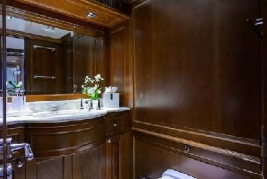 a bathroom with a large mirror aboard ARTHUR’S WAY Yacht for Sale