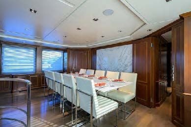 a room with tables and chairs aboard ARTHUR’S WAY Yacht for Sale