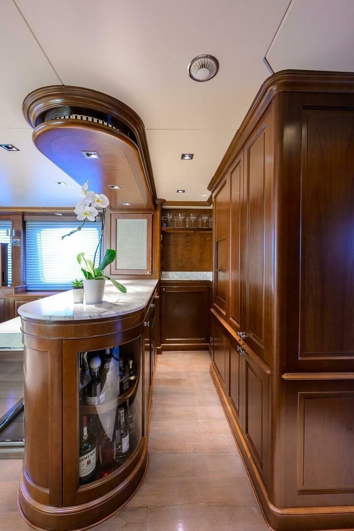 a large wooden cabinet in a room aboard ARTHUR’S WAY Yacht for Sale