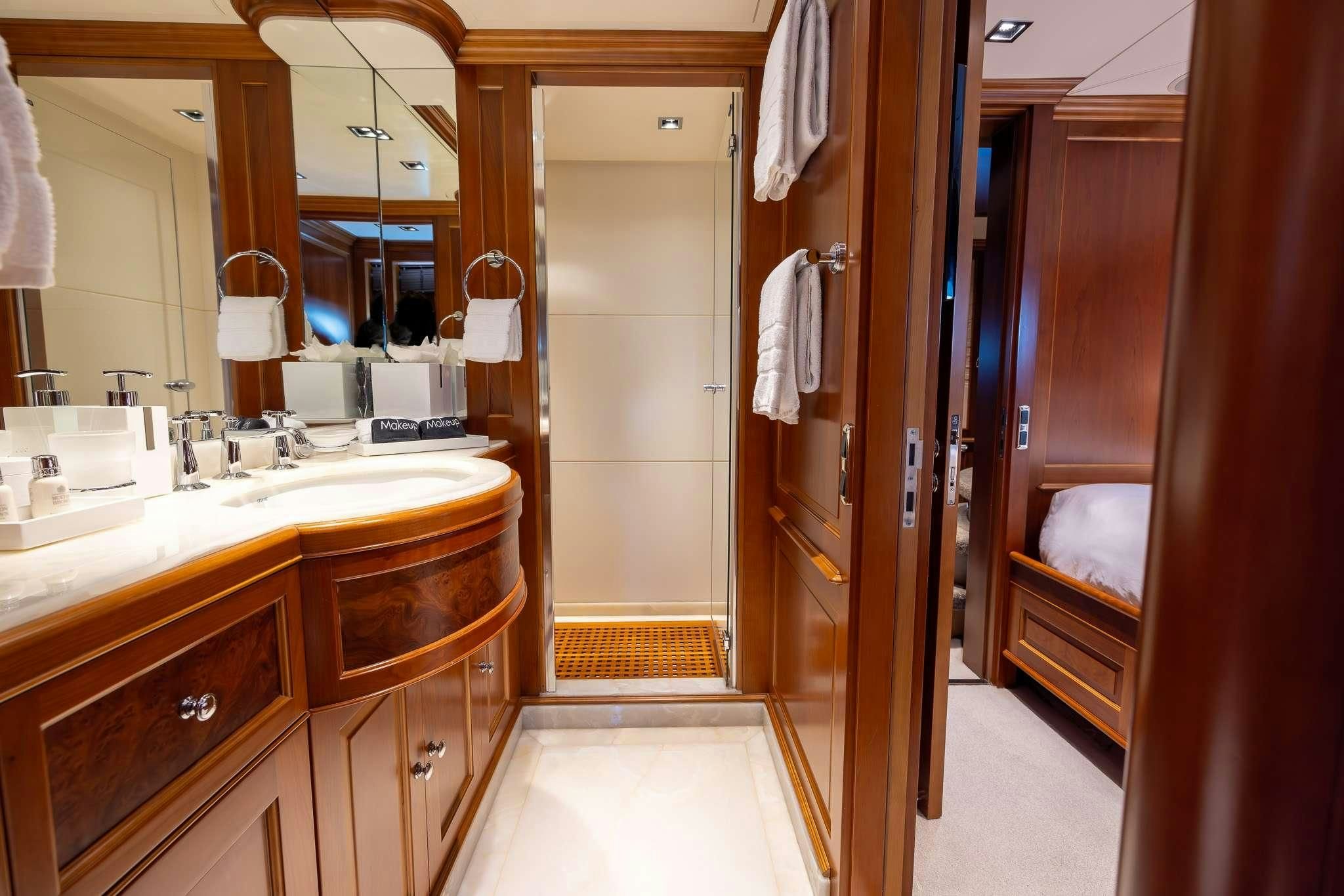 a bathroom with a sink and a mirror aboard ARTHUR’S WAY Yacht for Sale