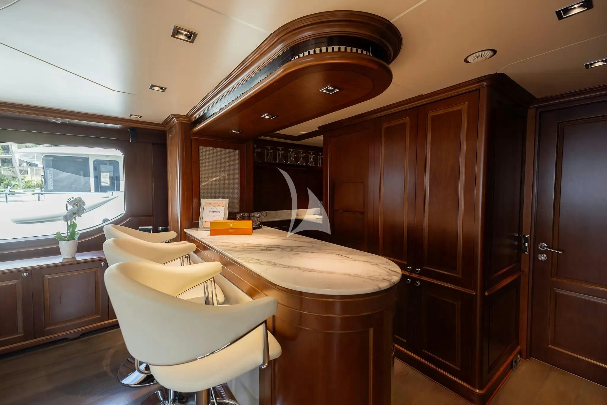 a room with a table and chairs aboard ARTHUR’S WAY Yacht for Sale