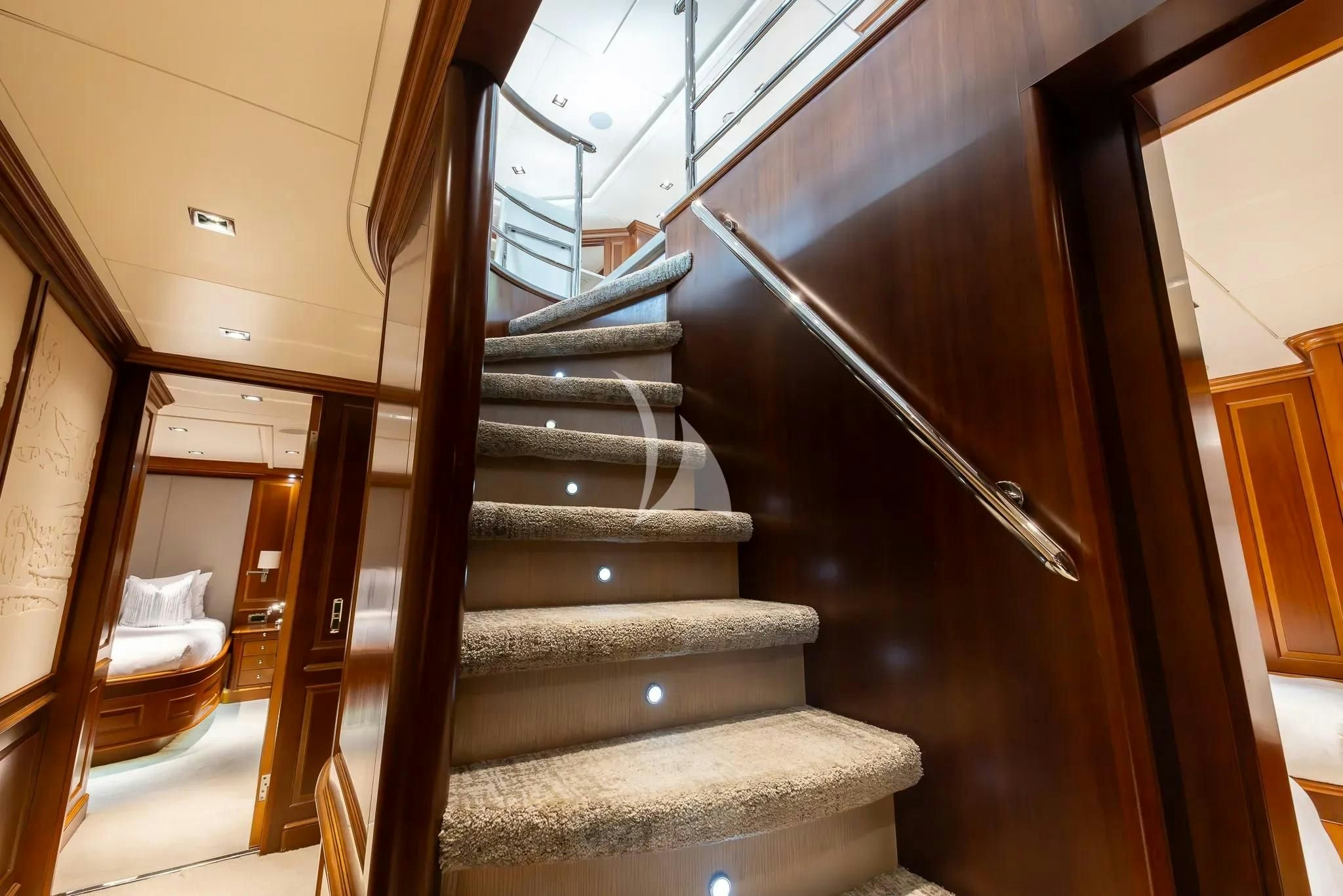 a set of stairs in a house aboard ARTHUR’S WAY Yacht for Sale