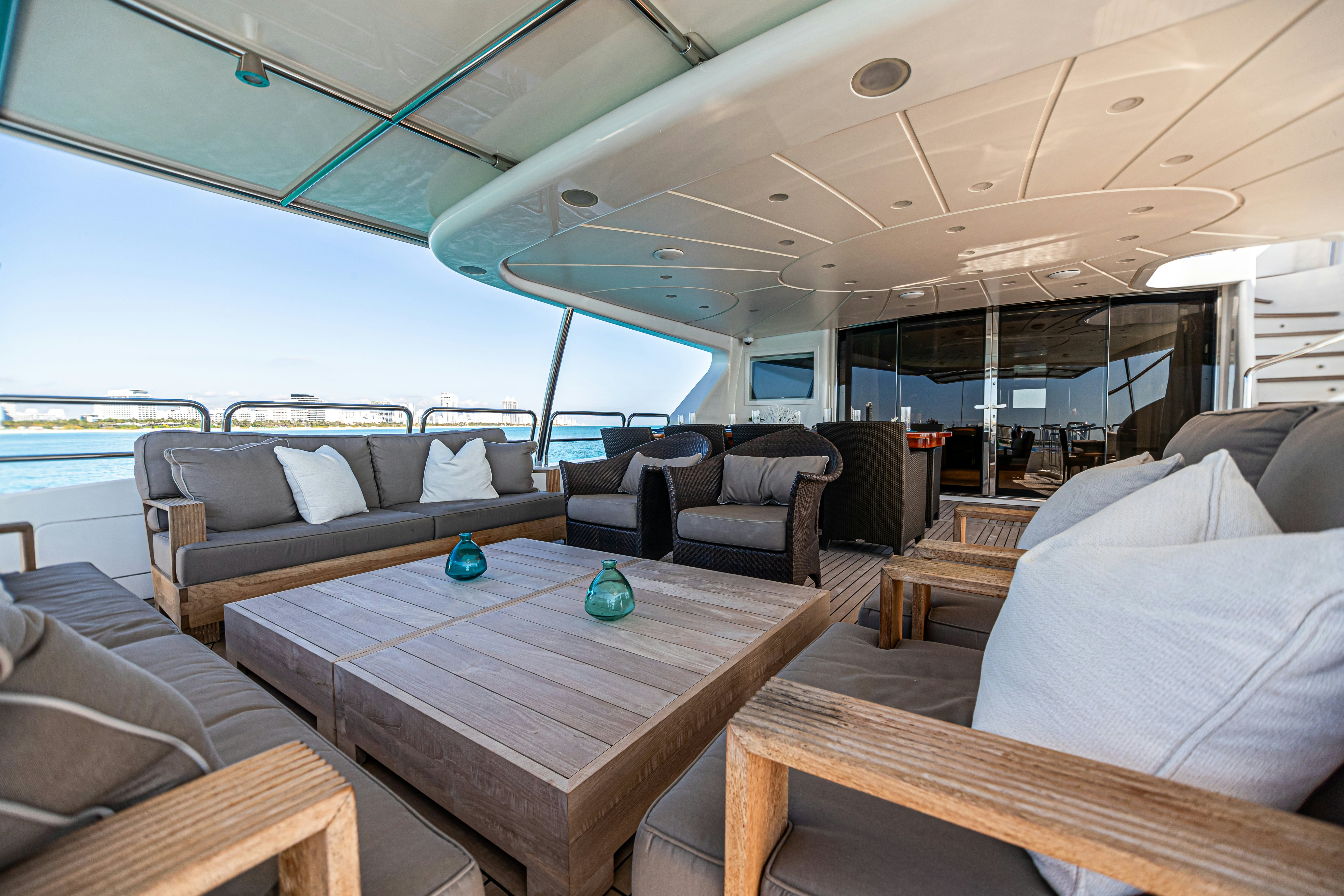 a living room with a table and couches aboard ARTHUR’S WAY Yacht for Sale