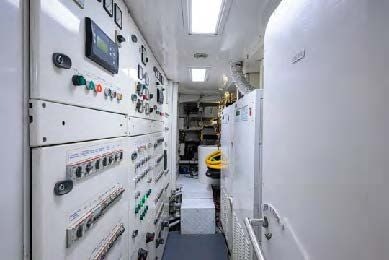 a room with white walls and a white wall with many magnets on it aboard ARTHUR’S WAY Yacht for Sale