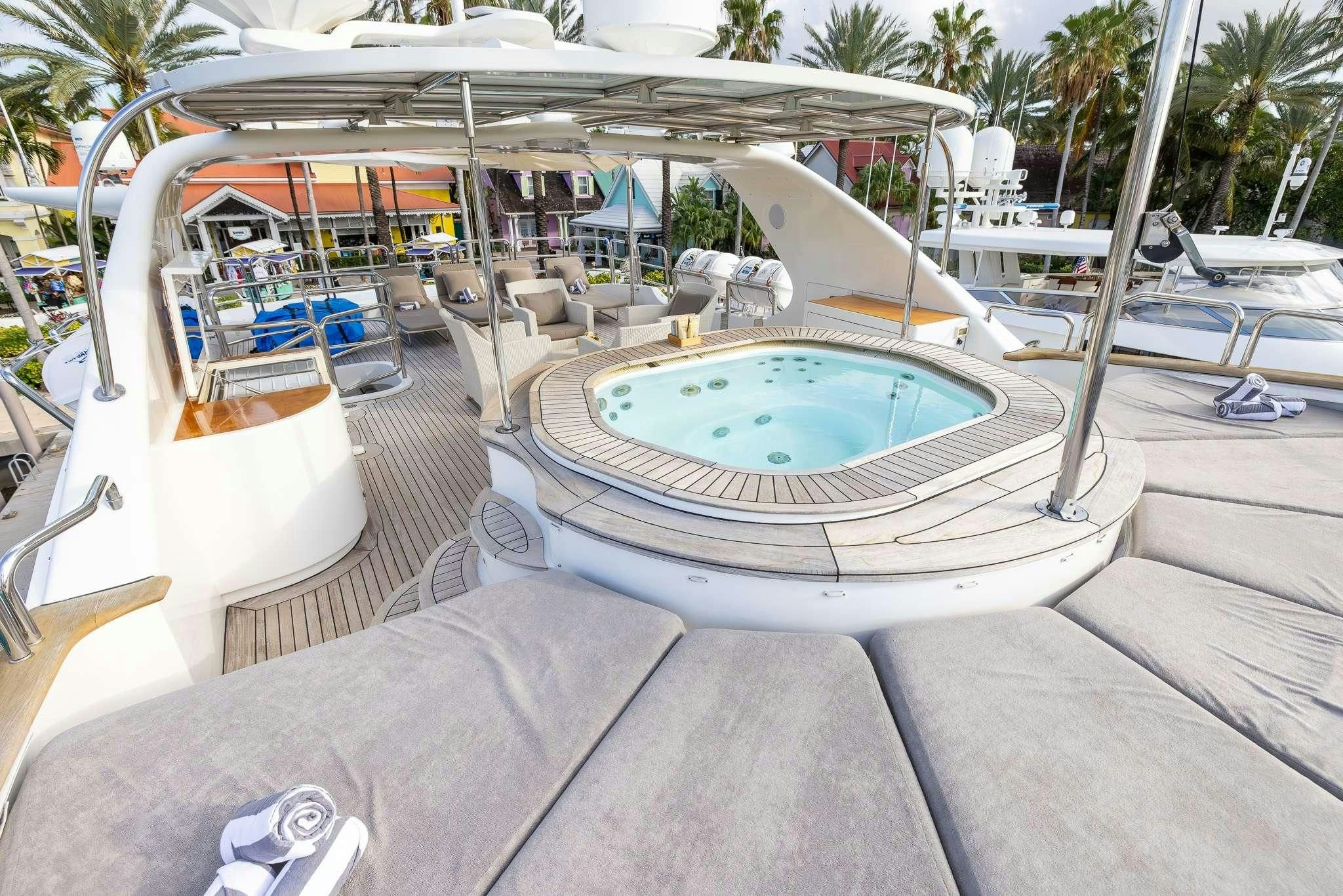 a swimming pool in a tropical setting aboard ARTHUR’S WAY Yacht for Sale