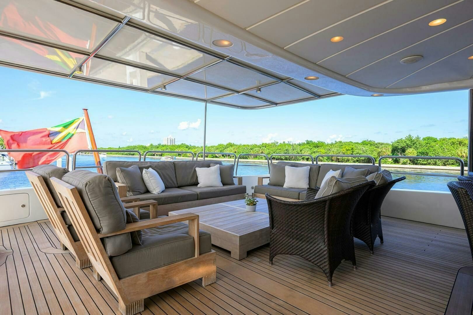 a deck with couches and a pool aboard ARTHUR’S WAY Yacht for Sale