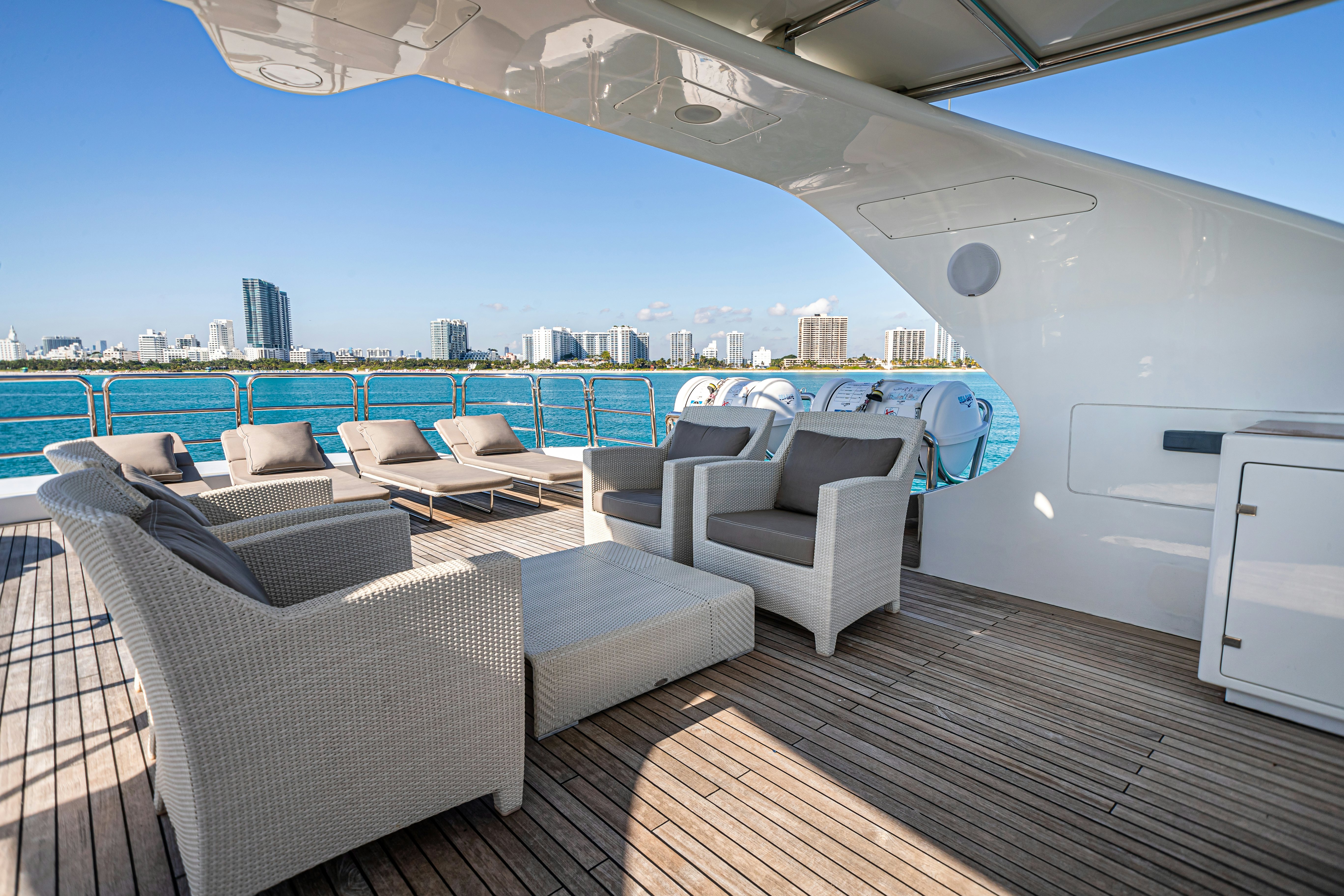 a deck with a view of a city and water aboard ARTHUR’S WAY Yacht for Sale