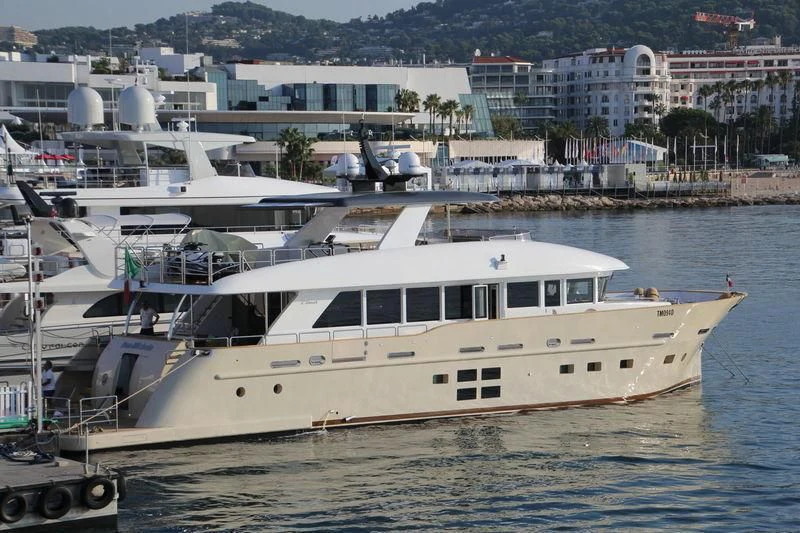 a large white boat in a harbor aboard DON MICHELE Yacht for Sale