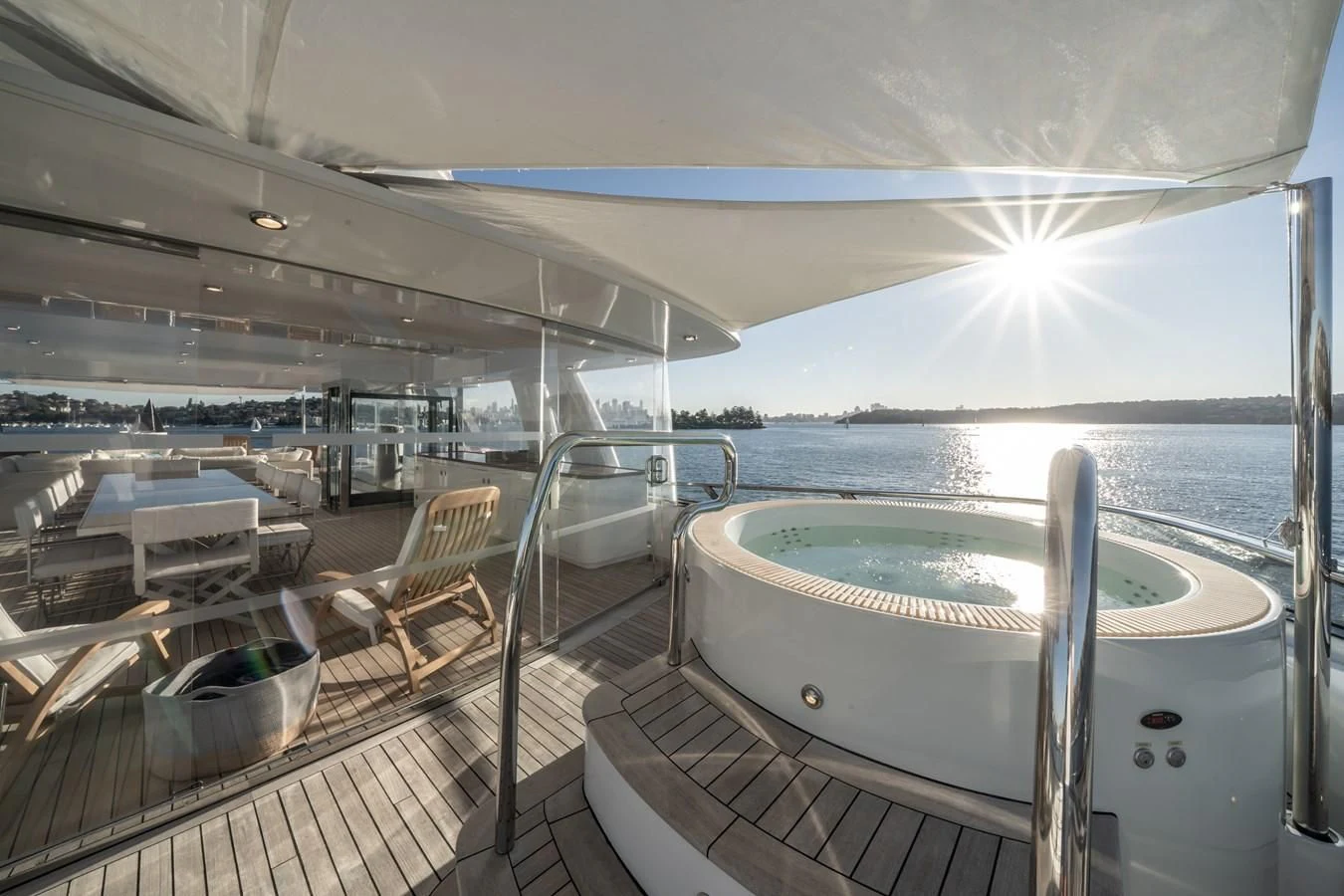 a deck with a pool and chairs aboard MOATIZE Yacht for Sale