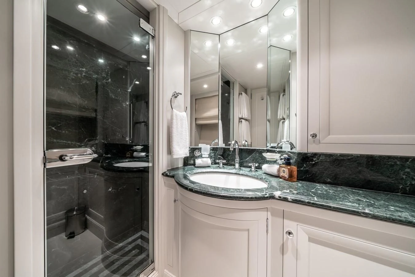 a bathroom with a large mirror aboard MOATIZE Yacht for Sale