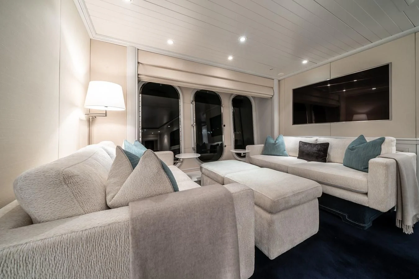 a room with a couch and a television aboard MOATIZE Yacht for Sale