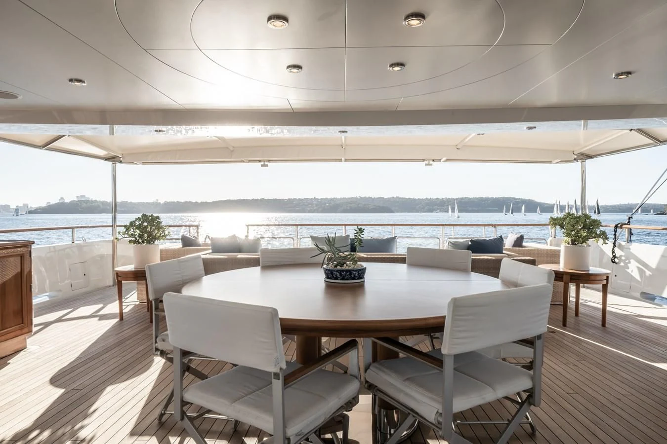 a room with a table and chairs aboard MOATIZE Yacht for Sale