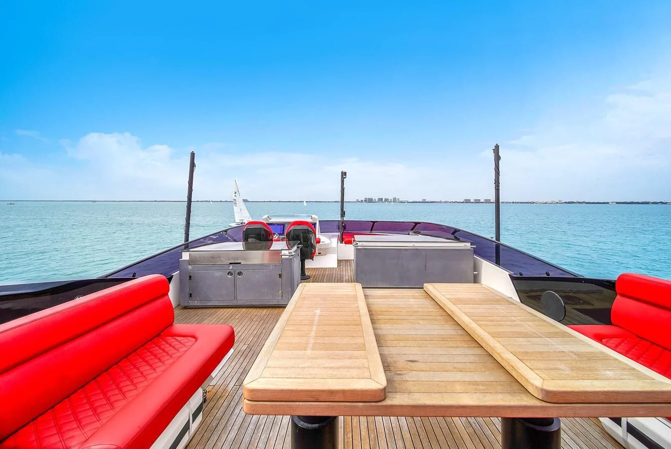 a deck with a boat on it and a body of water in the background aboard SUNSEEKER 115 SPORT YACHT Yacht for Sale