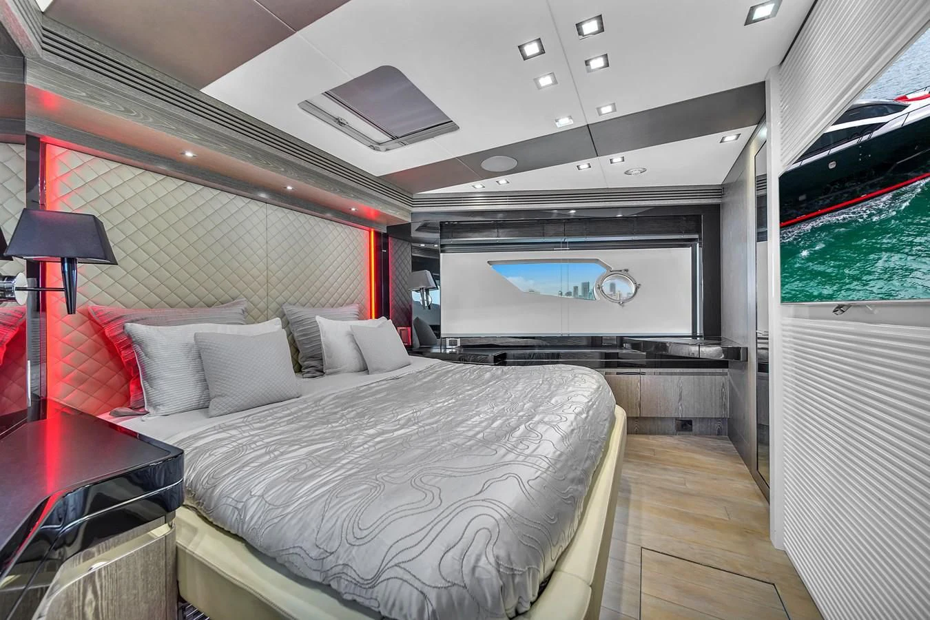 a room with a bed and a television aboard SUNSEEKER 115 SPORT YACHT Yacht for Sale