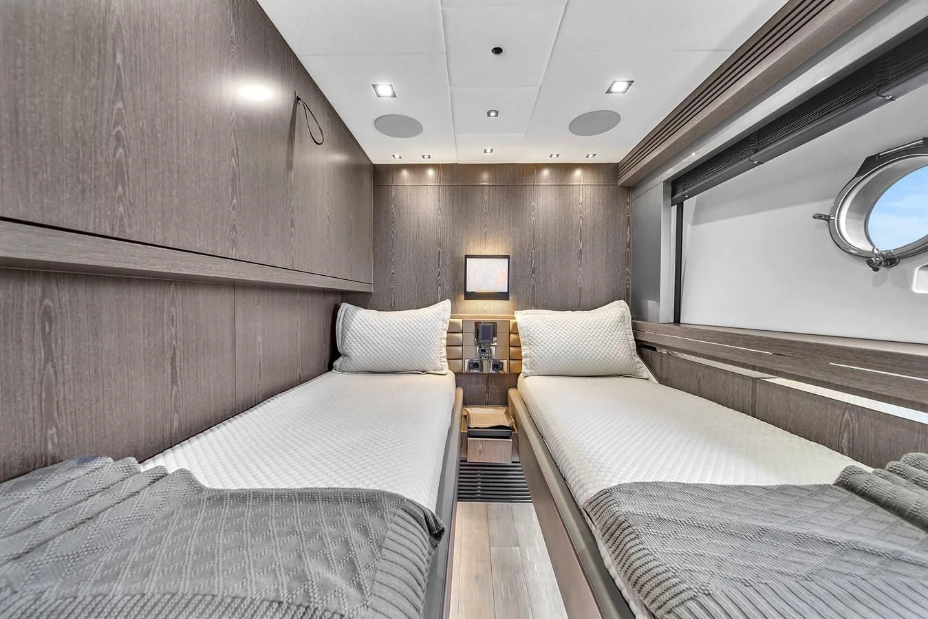 a room with two beds aboard SUNSEEKER 115 SPORT YACHT Yacht for Sale