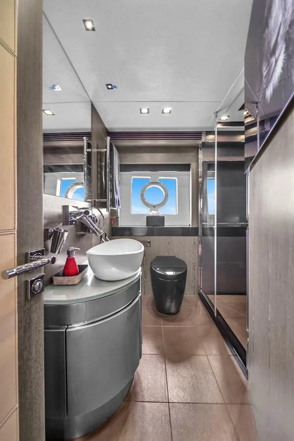 a bathroom with a sink and a mirror aboard SUNSEEKER 115 SPORT YACHT Yacht for Sale