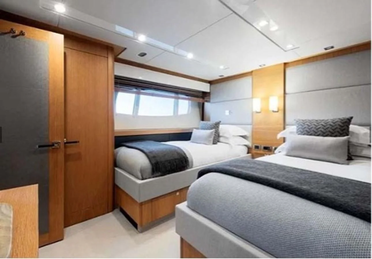 a room with two beds aboard SUNSEEKER 115 SPORT YACHT Yacht for Sale