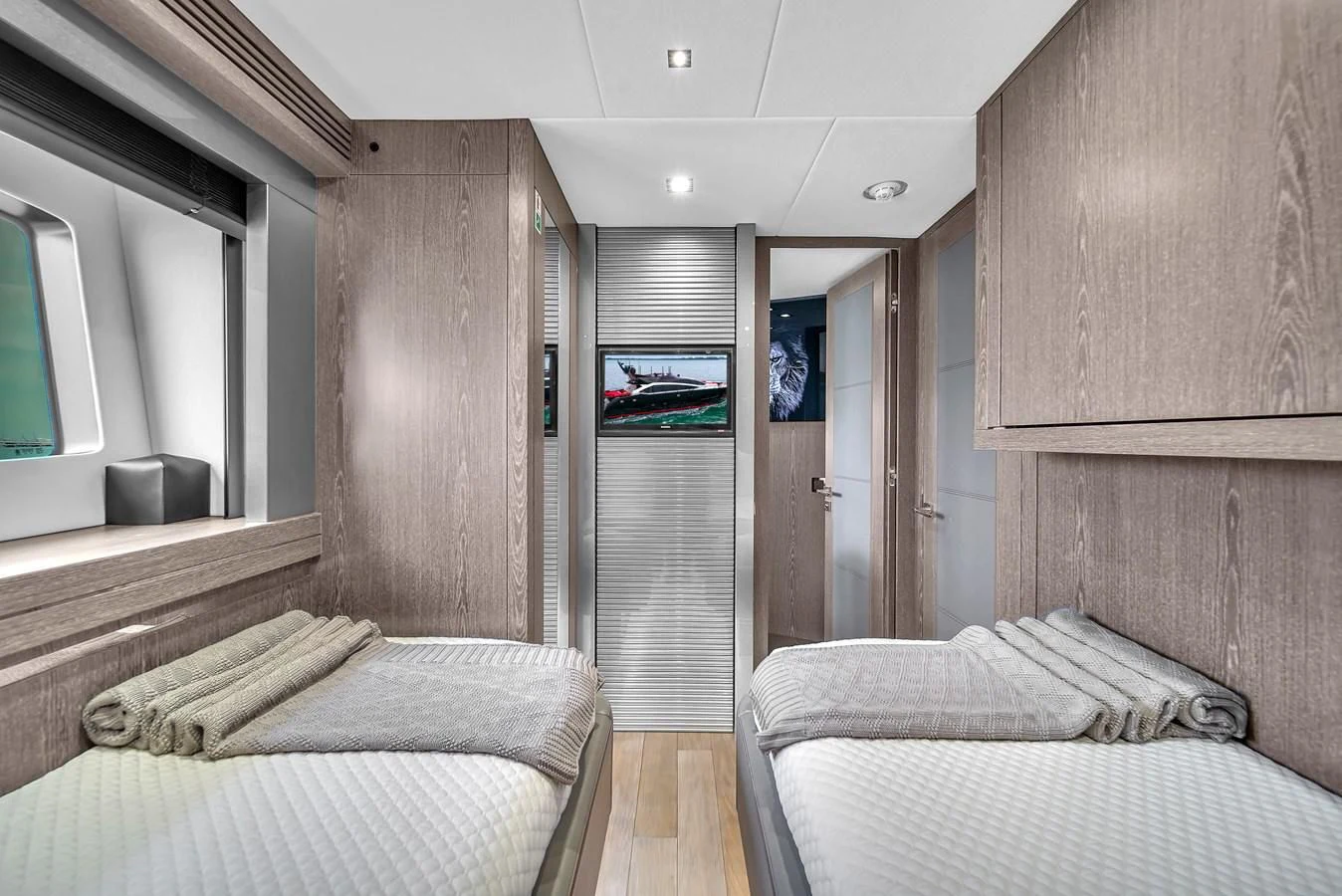 a room with a bed and a closet aboard SUNSEEKER 115 SPORT YACHT Yacht for Sale