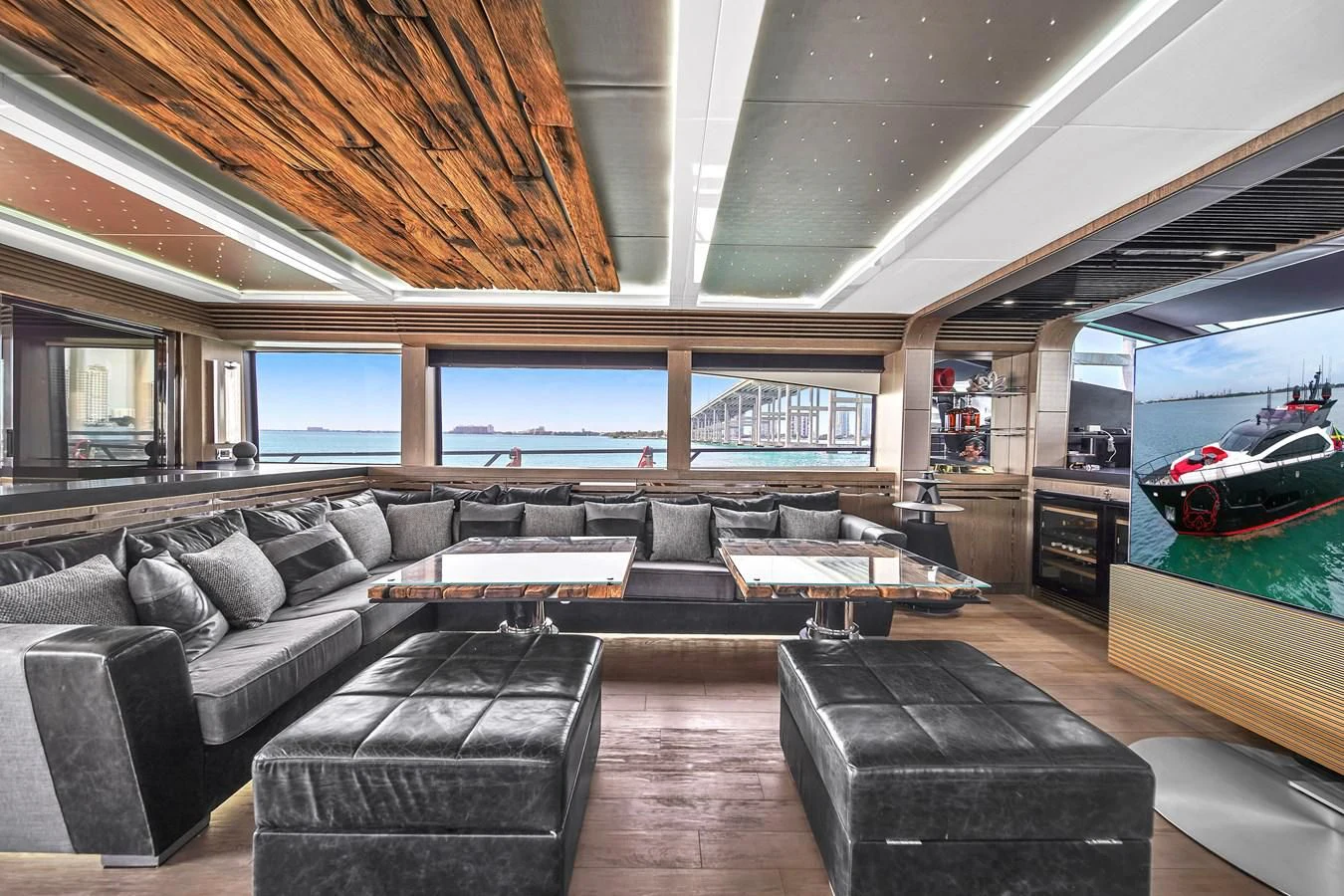 a living room with a large sofa aboard SUNSEEKER 115 SPORT YACHT Yacht for Sale