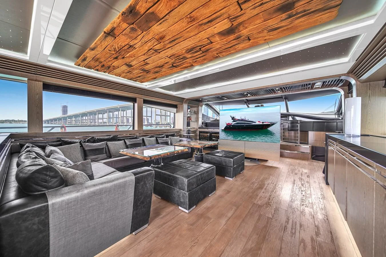 a living room with a large window aboard SUNSEEKER 115 SPORT YACHT Yacht for Sale