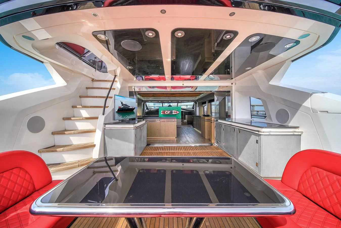 a staircase with a glass door aboard SUNSEEKER 115 SPORT YACHT Yacht for Sale