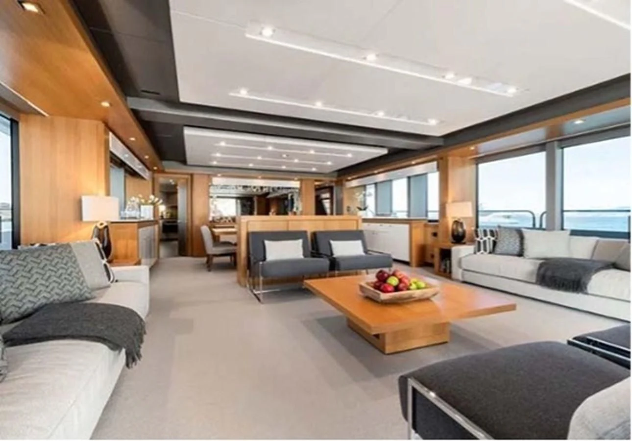 a living room with a couch and a table aboard SUNSEEKER 115 SPORT YACHT Yacht for Sale