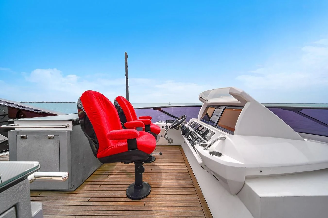 a chair on a deck aboard SUNSEEKER 115 SPORT YACHT Yacht for Sale