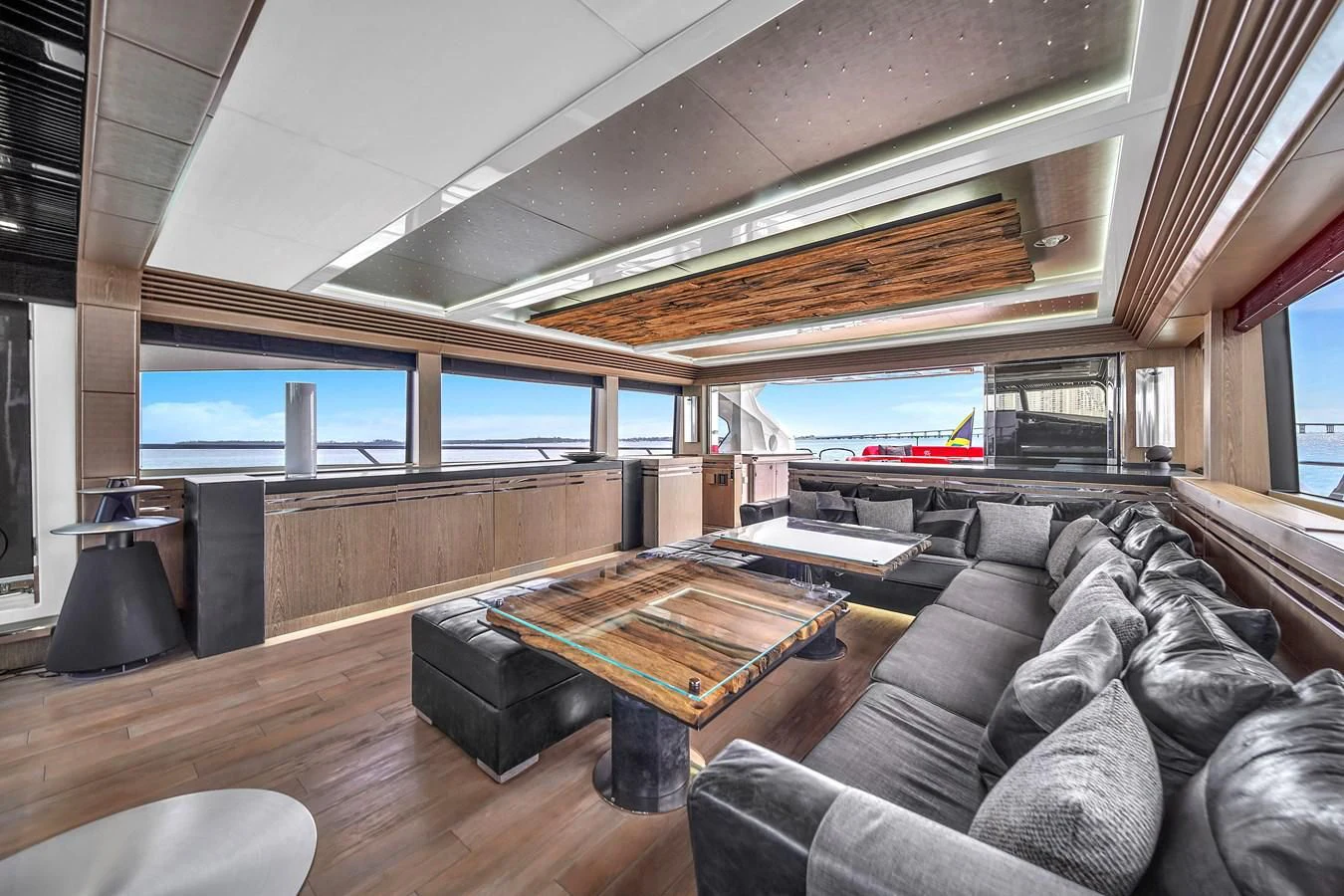 a room with a couch and a tv aboard SUNSEEKER 115 SPORT YACHT Yacht for Sale