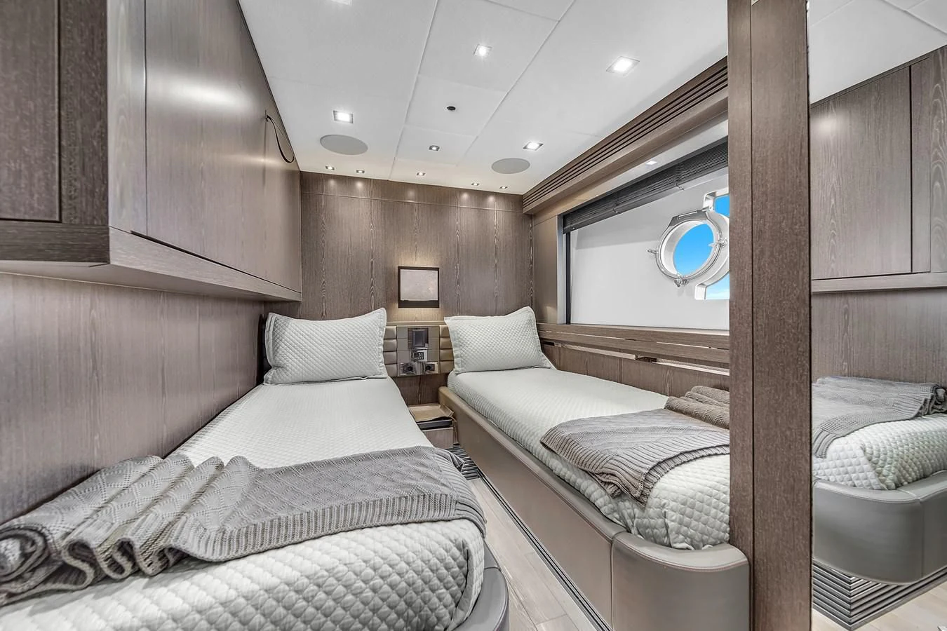 a room with two beds aboard SUNSEEKER 115 SPORT YACHT Yacht for Sale