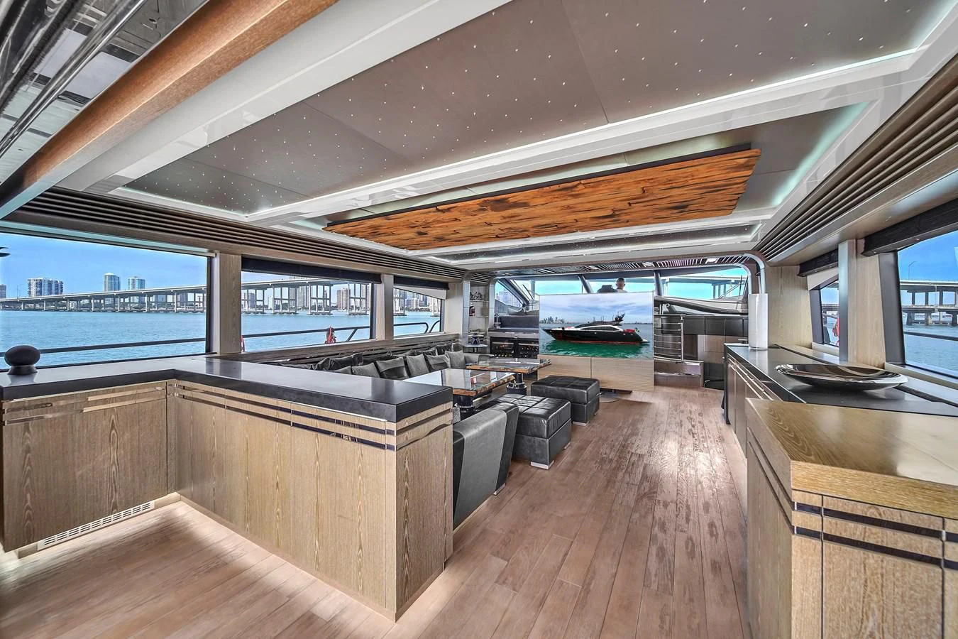 a room with a wood floor and a large window with a wood floor aboard SUNSEEKER 115 SPORT YACHT Yacht for Sale