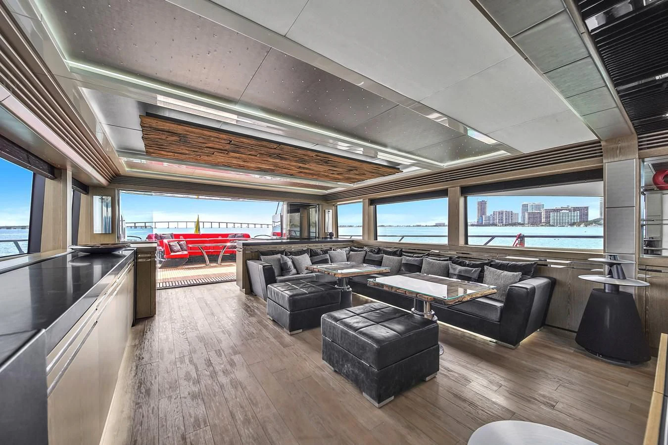 a large room with couches and a table aboard SUNSEEKER 115 SPORT YACHT Yacht for Sale