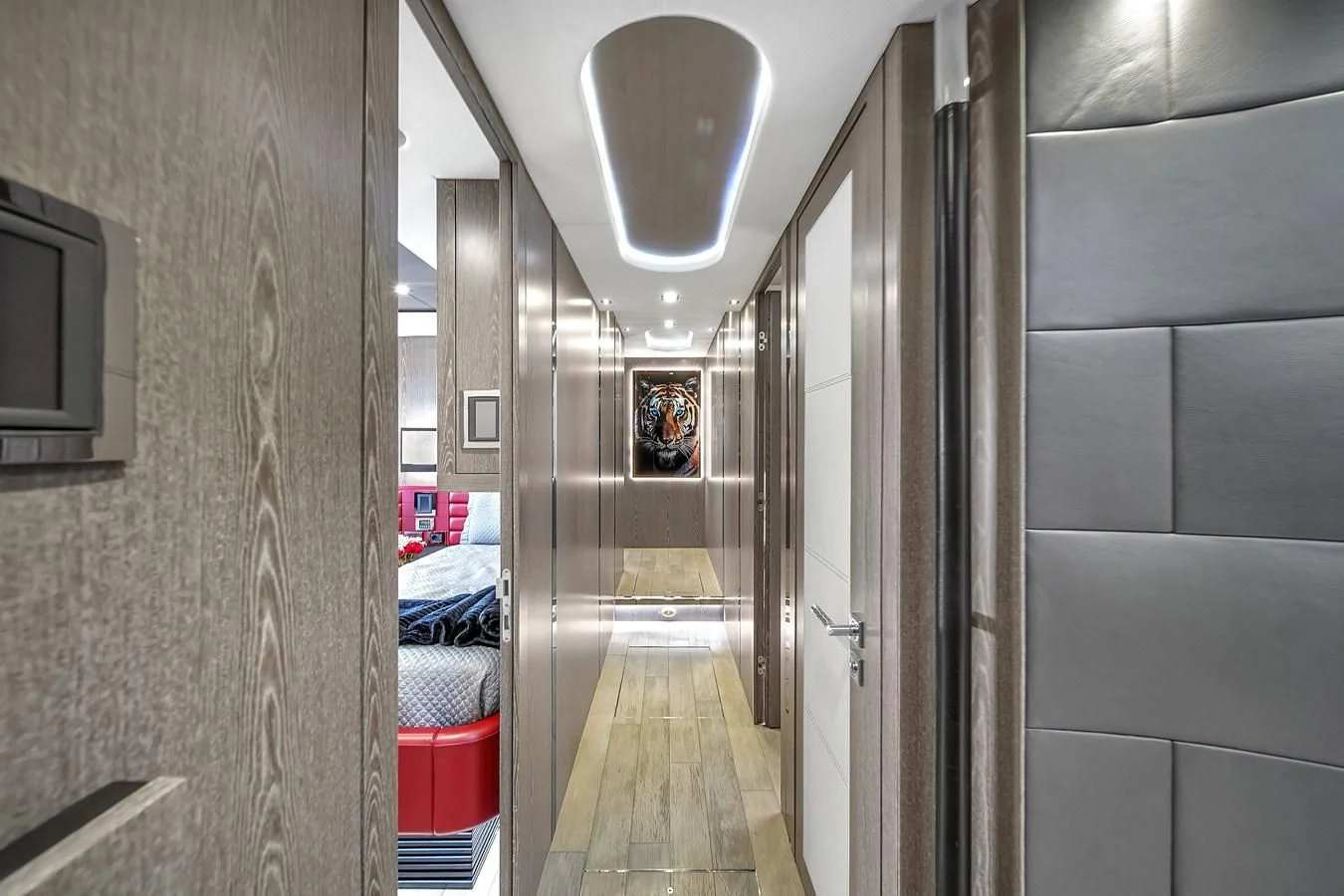 a hallway with a bed and a mirror aboard SUNSEEKER 115 SPORT YACHT Yacht for Sale
