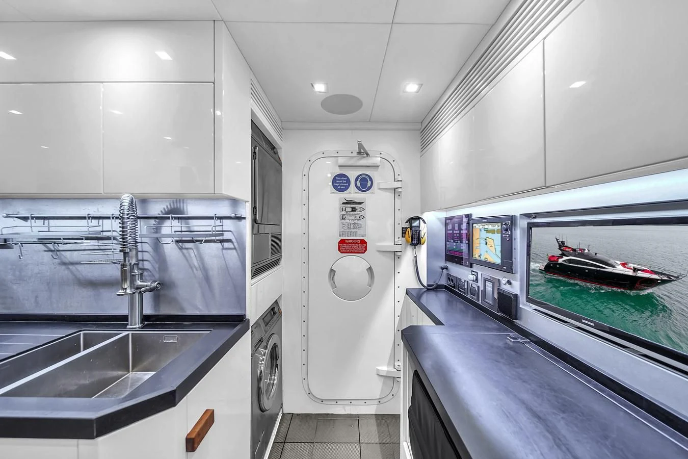 a white machine in a room aboard SUNSEEKER 115 SPORT YACHT Yacht for Sale