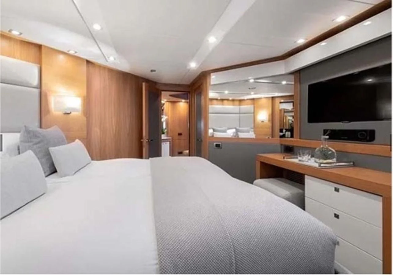 a large bed in a room aboard SUNSEEKER 115 SPORT YACHT Yacht for Sale