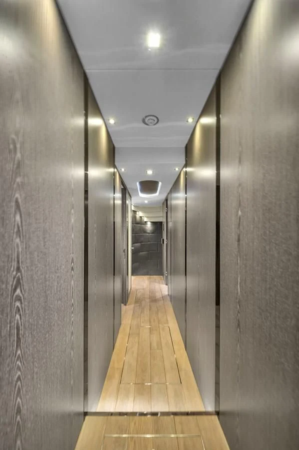 a hallway with a light on the ceiling aboard SUNSEEKER 115 SPORT YACHT Yacht for Sale