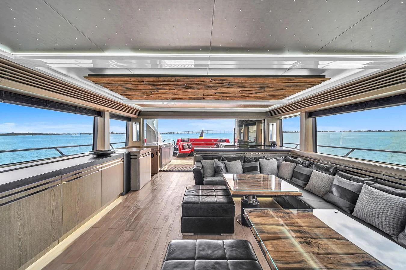 a train with a deck and benches aboard SUNSEEKER 115 SPORT YACHT Yacht for Sale