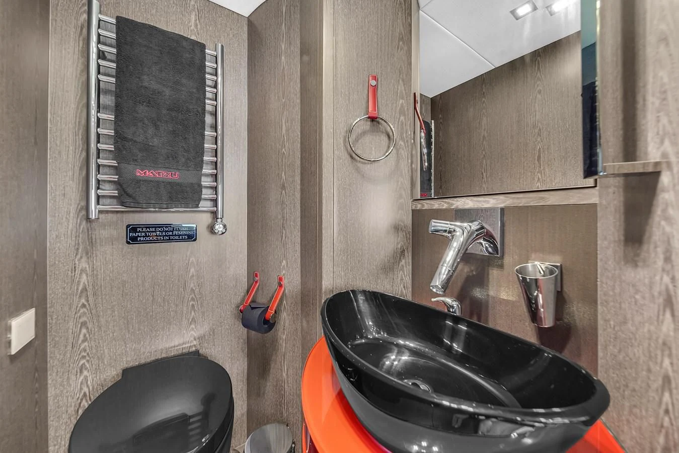 a sink and a toilet in a bathroom aboard SUNSEEKER 115 SPORT YACHT Yacht for Sale