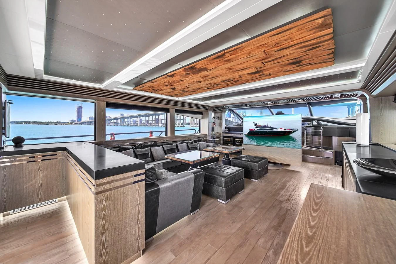 a room with a pool table and couches aboard SUNSEEKER 115 SPORT YACHT Yacht for Sale