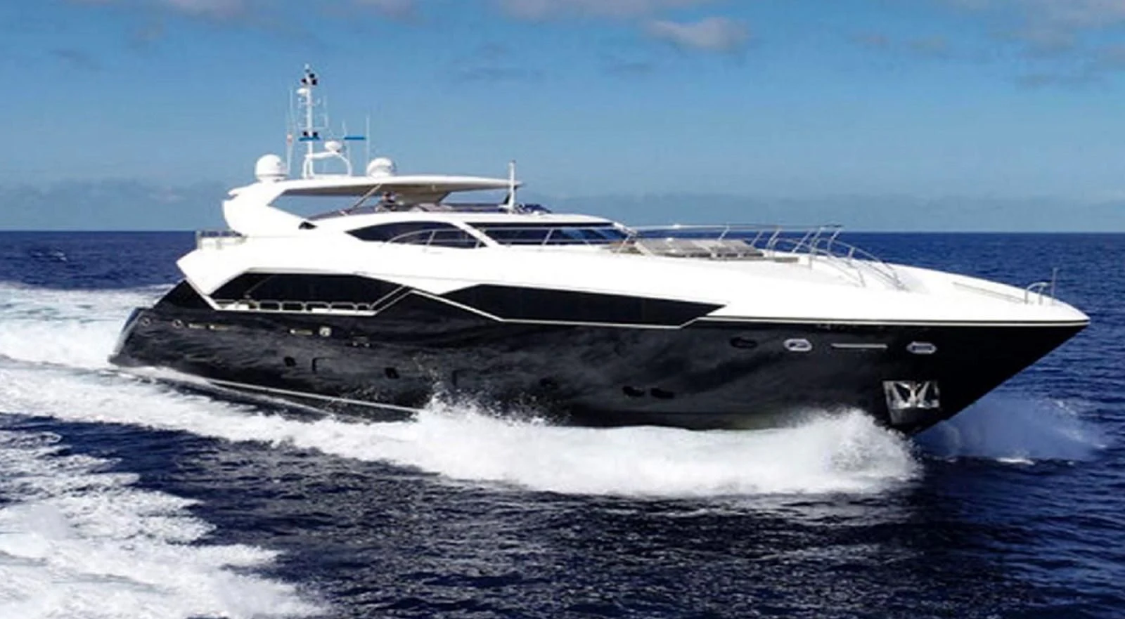 a boat on the water aboard SUNSEEKER 115 SPORT YACHT Yacht for Sale
