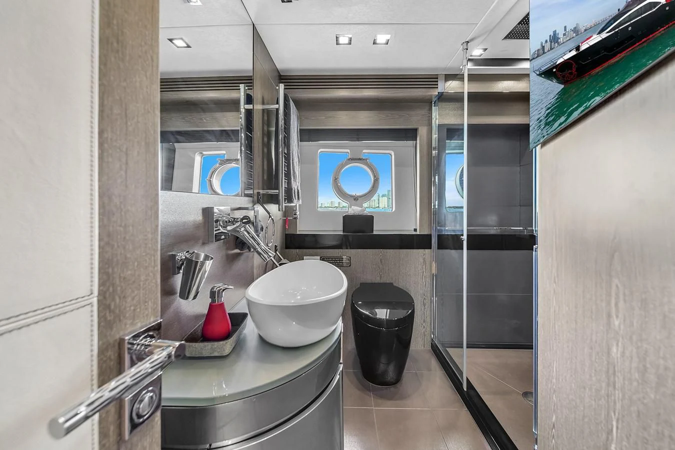 a bathroom with a sink and a mirror aboard SUNSEEKER 115 SPORT YACHT Yacht for Sale