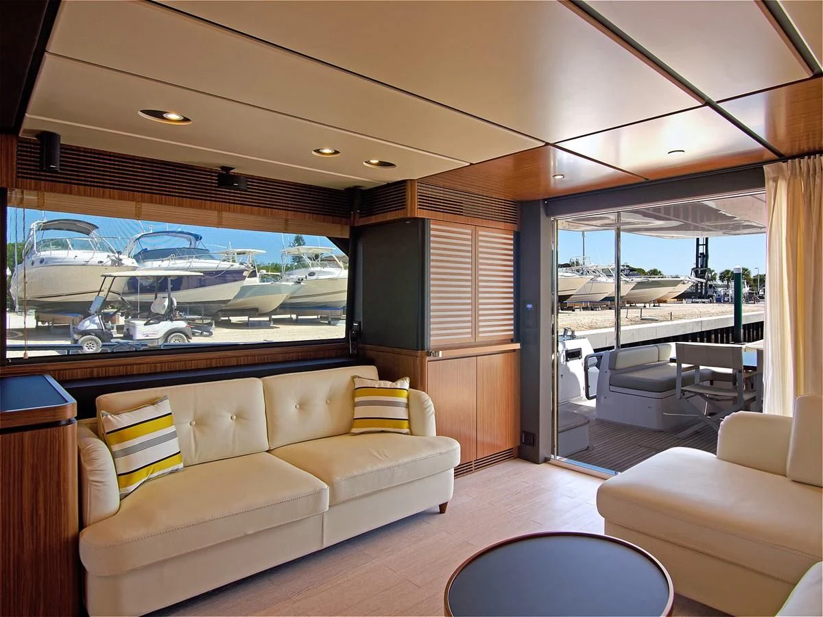 a living room with a view of the water aboard 2017 AZIMUT 66 MAGELLANO Yacht for Sale
