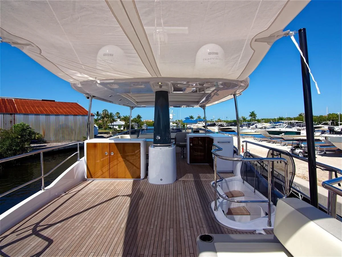 a deck with a deck and chairs aboard 2017 AZIMUT 66 MAGELLANO Yacht for Sale