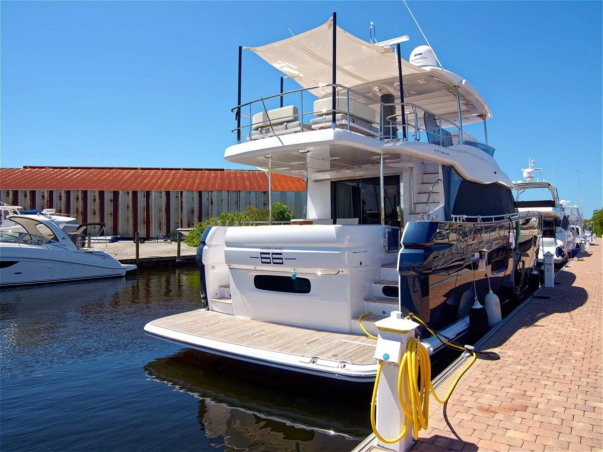 a boat docked at a dock aboard 2017 AZIMUT 66 MAGELLANO Yacht for Sale