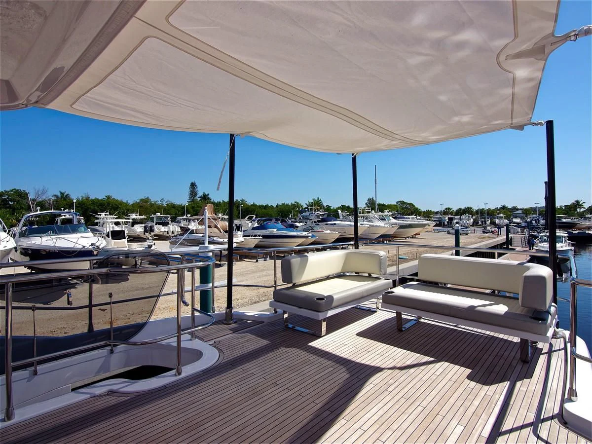 a deck with a lounge chair and a large body of water aboard 2017 AZIMUT 66 MAGELLANO Yacht for Sale