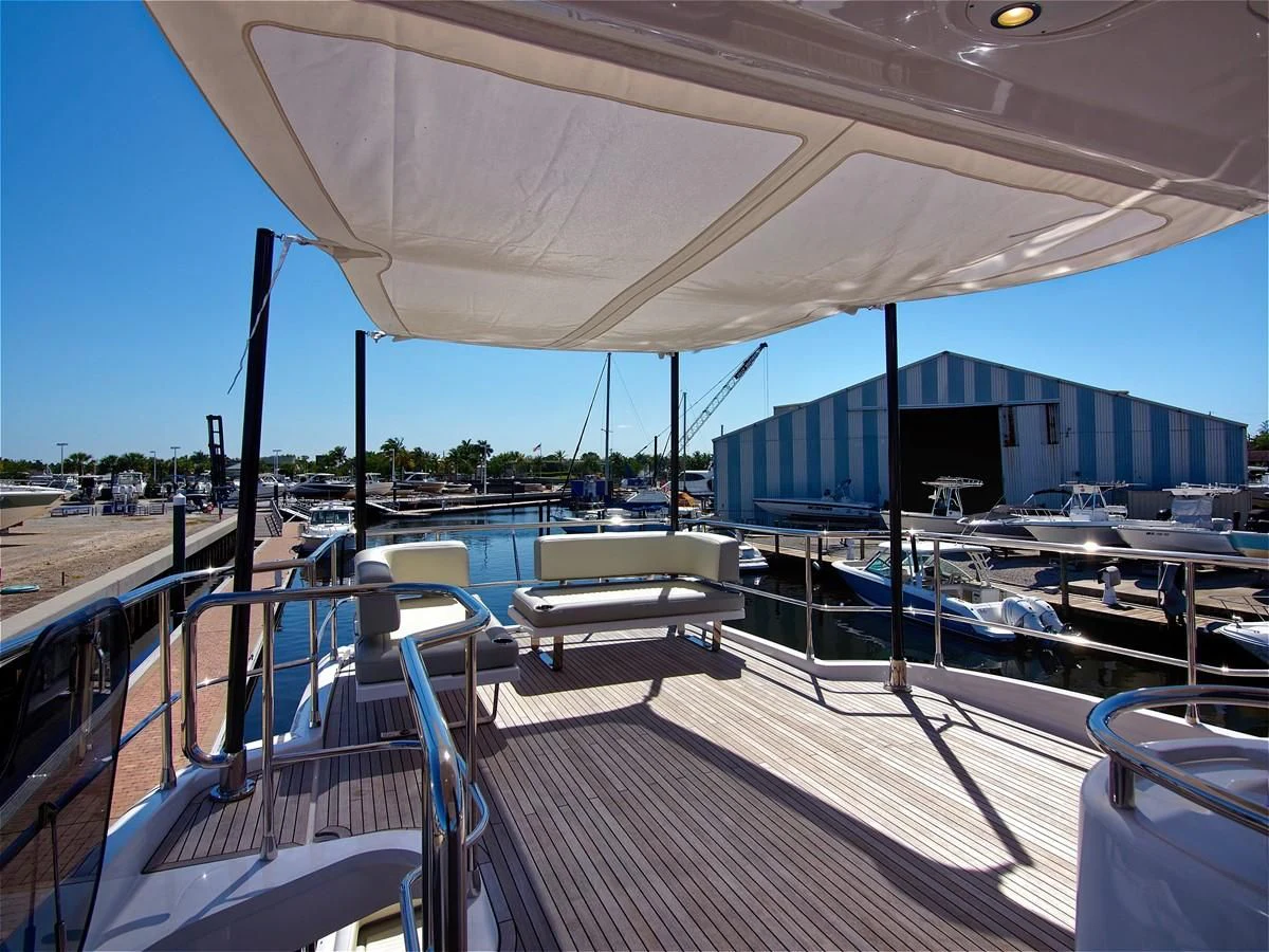 a deck with a deck and chairs aboard 2017 AZIMUT 66 MAGELLANO Yacht for Sale