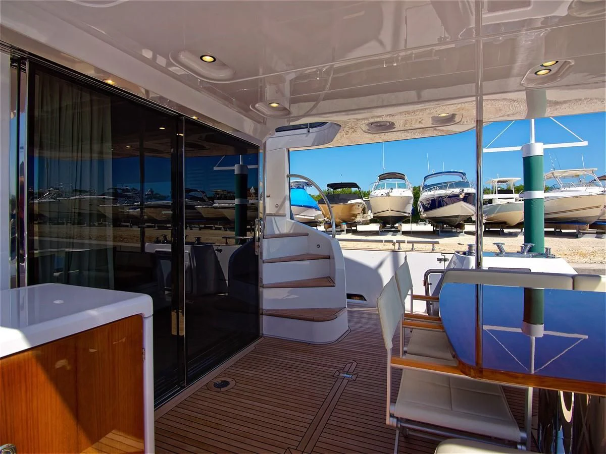 a boat is parked in a harbor aboard 2017 AZIMUT 66 MAGELLANO Yacht for Sale