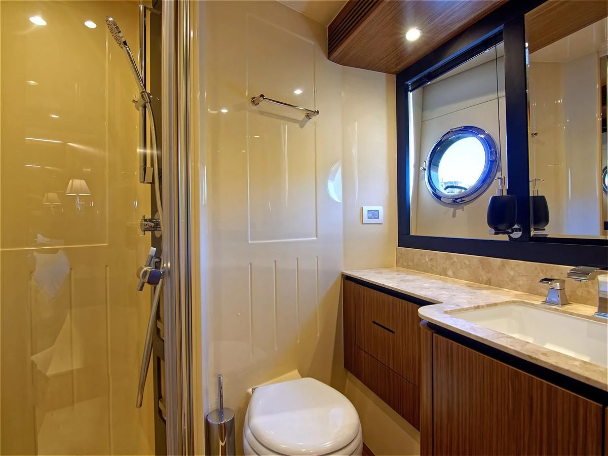 a bathroom with a toilet and a sink aboard 2017 AZIMUT 66 MAGELLANO Yacht for Sale