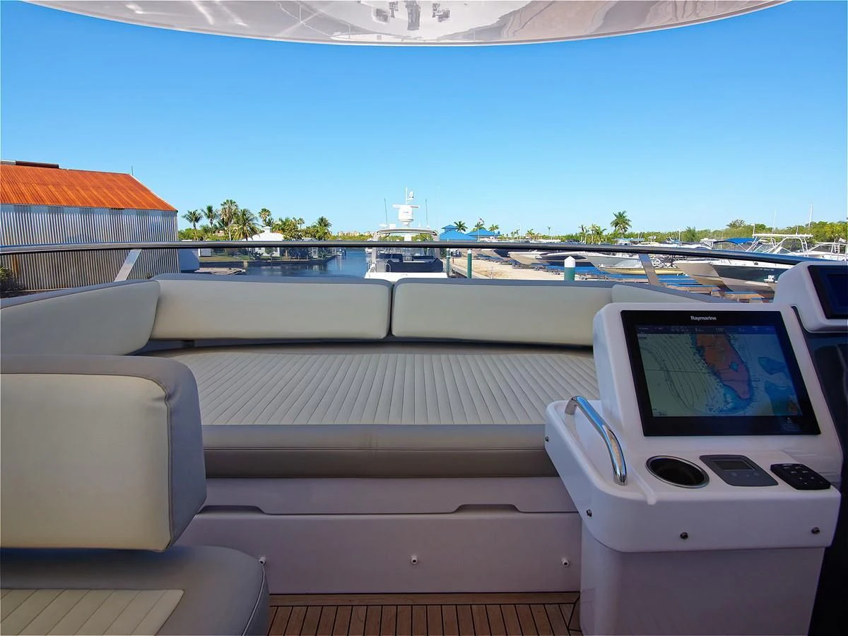 a white car parked on a deck aboard 2017 AZIMUT 66 MAGELLANO Yacht for Sale